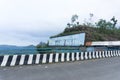WONOSOBO, INDONESIA Ã¢â¬â JULY 5, 2021: A hill marked with the Wadaslintang reservoir in Central Java as a marker for the name