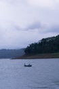 WONOSOBO, INDONESIA Ã¢â¬â JUNE 19, A fisherman who was sailing looking for fish in the middle of the lake