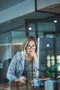 She wont stop until its done. a businesswoman working late at night in her office.