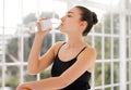 Wont stop til its over. a ballet dancer taking a water break between dance routines.