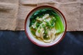 wonton soup or pangsit or dumplings soup and vegetable. wonton is traditional Chinese food of minced meat wrapped in flour sheets Royalty Free Stock Photo