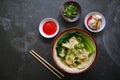 wonton soup or pangsit or dumplings soup and vegetable. wonton is traditional Chinese food of minced meat wrapped in flour sheets Royalty Free Stock Photo