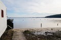 Wood access pontoon sand beach on Lake Hourtin in Gironde france Royalty Free Stock Photo