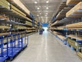 The wood aisle at Lowes home improvement store with stacks of lumber waiting for customers to purchase Royalty Free Stock Photo