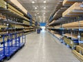 The wood aisle at Lowes home improvement store with stacks of lumber waiting for customers to purchase Royalty Free Stock Photo