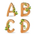 Wood alphabet with branch green leaves Royalty Free Stock Photo