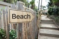 Wood arrow to beach in outdoors coutryside