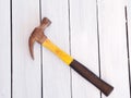 Wood background with a hammer