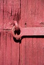 Wood background of red wooden door. Iron metal safety locker. Wood textures