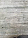 Wood background texture, closeup of table outdoors. Planks in horizontal alignment. Surface has several large sections.