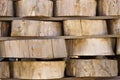 Wood background texture. Cross section of tree trunk. spili trees stumps stacked in stacks. Used for garden doropok, interior and