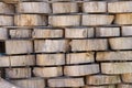 Wood background texture. Cross section of tree trunk. spili trees stumps stacked in stacks. Used for garden doropok, interior and