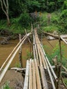Wood bamboo bridge over river water pai cave tour tourism chiang mai thailand hiking adventure