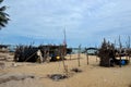 Wood and bamboo palm leaf shacks by seaside in fishing village Pattani Thailand