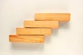 Wood bar pieces with shadows on white background. Climbing horizontal wooden bars as concept of kids development toy, construction