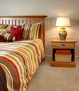 Wood bed and nightstand with stripes