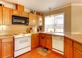 Wood and beige walls American standart kitchen. Royalty Free Stock Photo