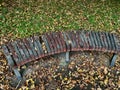 Wood bench in autumn park Duchcov. Autumn landscape. Hand-painted colorful stone on bench Royalty Free Stock Photo