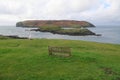 Wood bench overlooking offshore islands