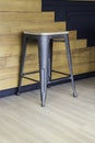 Wood and black metal bar chair on wall background Royalty Free Stock Photo