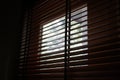 Wood blind shade curtain and shadow Royalty Free Stock Photo