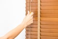 Wood blinds closed by hand. Royalty Free Stock Photo