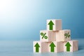 Wood block cubic stacking as step stair with green arrow up and Percent. Royalty Free Stock Photo