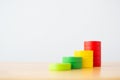 Wood block multicolor arranging stack step as staircase on wooden table