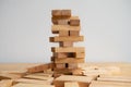 Wood block tower with architecture model, Concept Risk of management and strategy plan, growth business success process Royalty Free Stock Photo