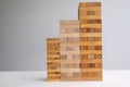 Wood block tower with architecture model, Concept Risk of management and strategy plan, growth business success process and team Royalty Free Stock Photo