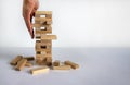 Wood block tower with architecture model. Concept Risk of management and strategy plan, growth business success process and team Royalty Free Stock Photo