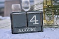 Wood blocks in box with date, day and month 4 August