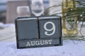 Wood blocks in box with date, day and month 9 August