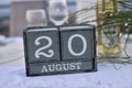 Wood blocks in box with date, day and month 20 August