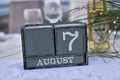 Wood blocks in box with date, day and month 7 August. Wooden calendar