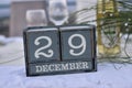 Wood blocks in box with date, day and month 29 December