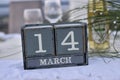 Wood blocks in box with date, day and month 14 March