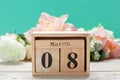 Wood blocks in box with date, day and month 8 March. Wooden blocks calendar