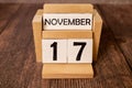 Wood blocks in box with date, day and month 17 November. Wooden blocks calendar