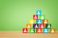 wood blocks pyramid with people icons, human resources and management concept Royalty Free Stock Photo