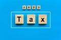 Wood blocks with tax word. Pay tax in 2023 years. The new year 2023 tax concept. Income tax return Royalty Free Stock Photo