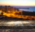 Wood board table in front of night sea landscape. Ready for product display montages