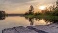 wood board table in front of sanset landscape of sparkling lake water. background is blurred. Royalty Free Stock Photo