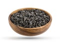 Wood bowl of black sunflower seeds isolated on white background Royalty Free Stock Photo