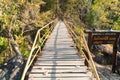 Wood bridge cross over the cliff