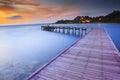 Wood bridge piers with nobody and smoothy sea water against beau