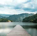 Wood bridge on the sea which has walk way for travel tourism with tropical forest island and sunshine with sky beautiful