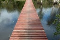 Wood bridge walkway along river Royalty Free Stock Photo