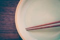 Wood brown chopsticks and celadon green ceramic Royalty Free Stock Photo