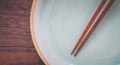 Wood brown chopsticks and celadon green ceramic Royalty Free Stock Photo
